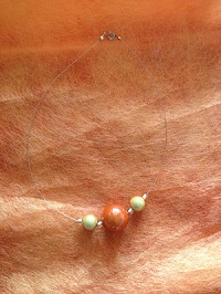 Collier court perles magique